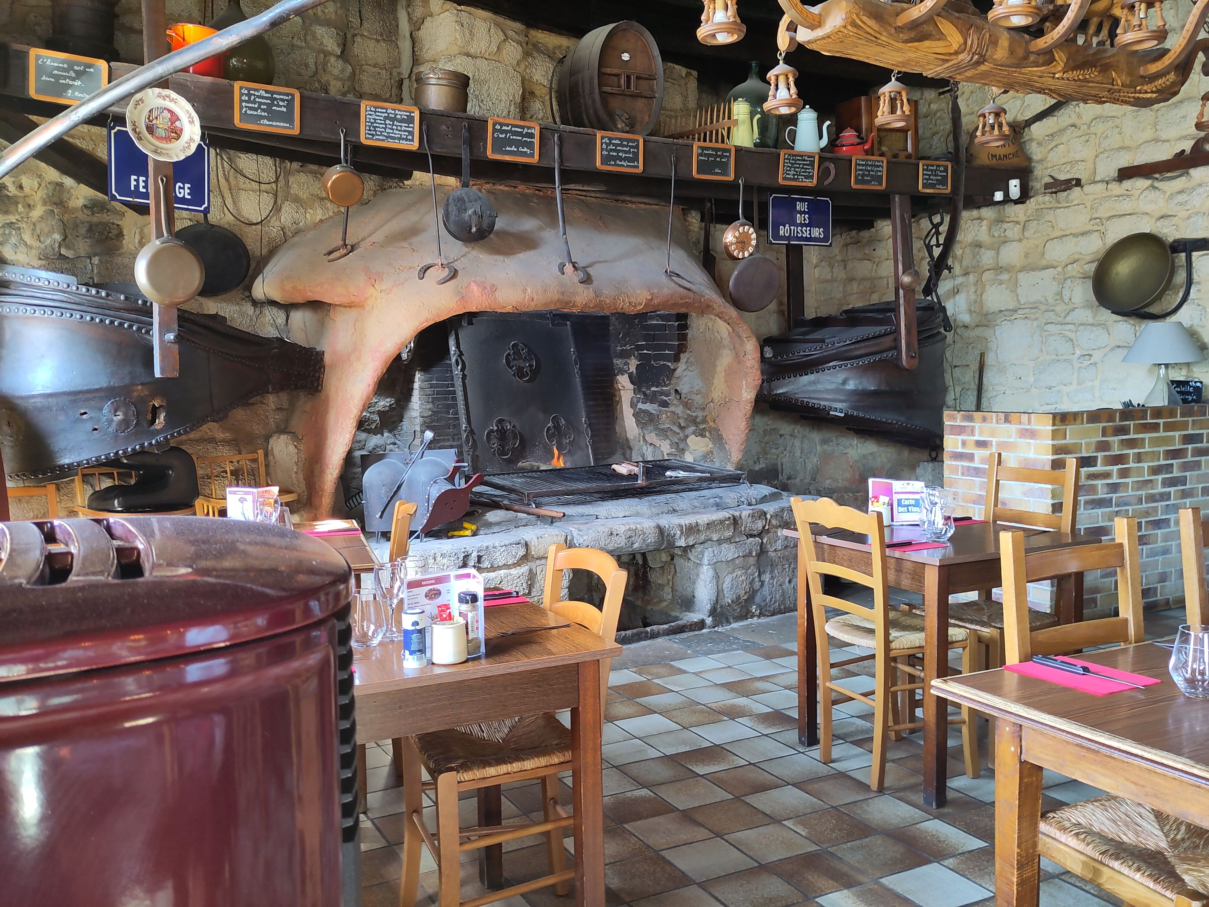 An old forge used to grill meat in a restaurant.