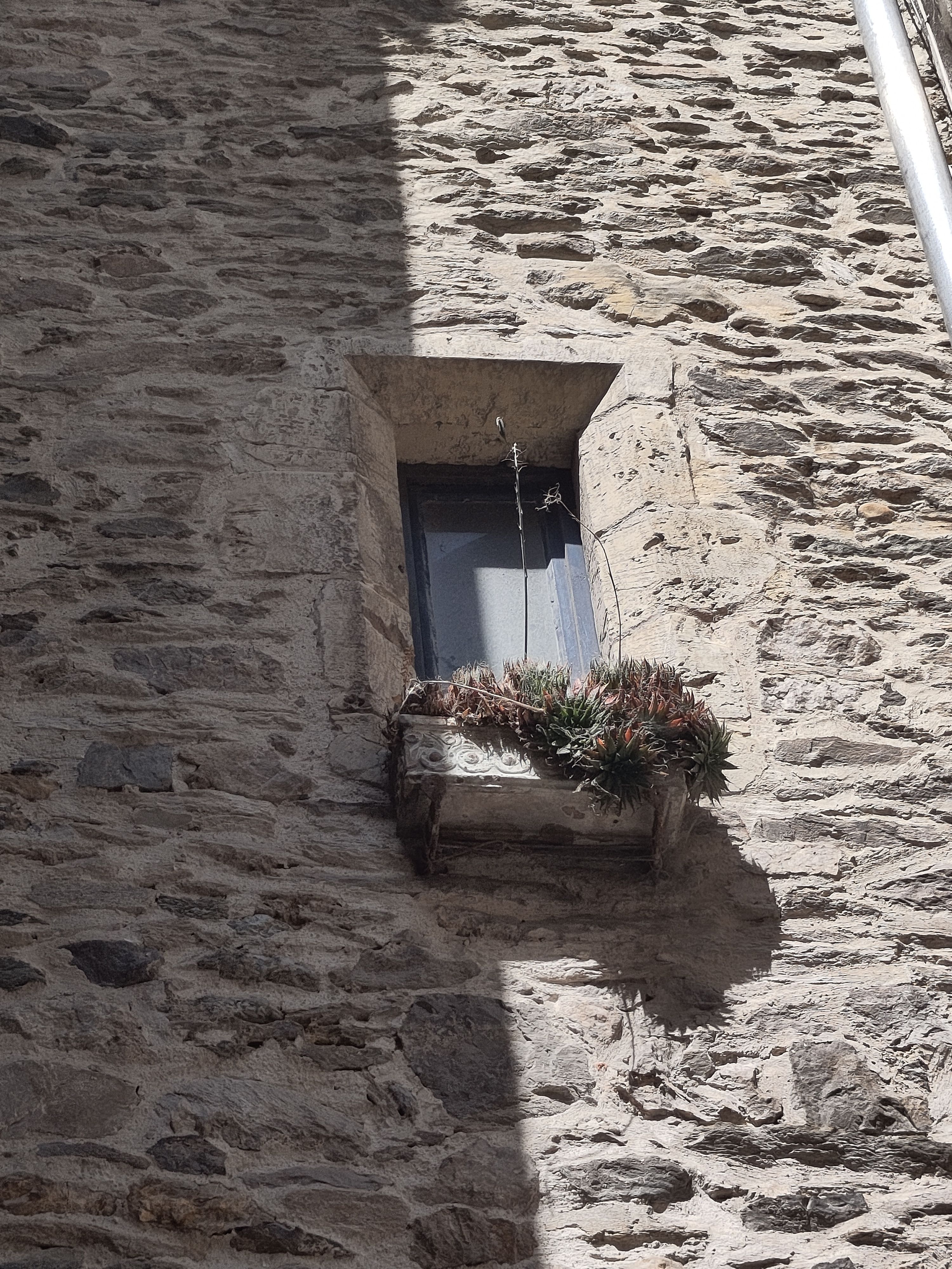  Narrow window in stone building